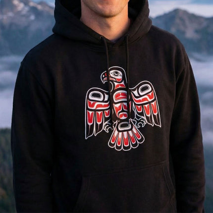 Red and white Northwest Coast tribal hawk graphic on black hoodie.