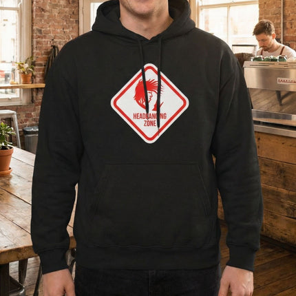 Black rock hoodie with "Headbanging Zone" devil graphic. Metal merch pullover for concert style.