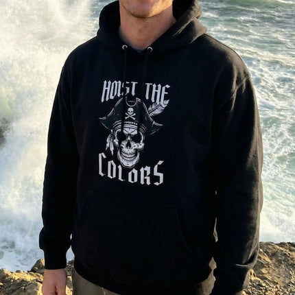Pirate skull graphic hoodie featuring "Hoist The Colors" text and tricorn hat design.
