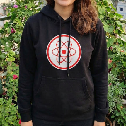 Black graphic hoodie featuring a red atomic orbital symbol. Science and physics apparel.