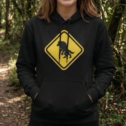 Werewolf warning sign graphic on a black pullover hoodie. Lycanthrope silhouette monster apparel.