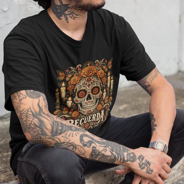 Decorated skull, marigolds, and candle artwork on a remembrance t-shirt.