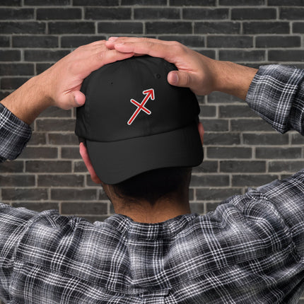 Red embroidered hat featuring the Sagittarius zodiac arrow symbol for astrology lovers.