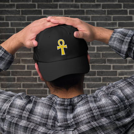 Black dad cap featuring gold embroidered Ankh Egyptian symbol of life design.