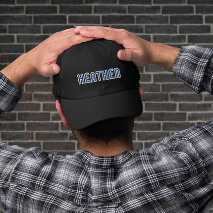 Blue and white baseball cap featuring embroidered Heathen text design on an unstructured dad hat.