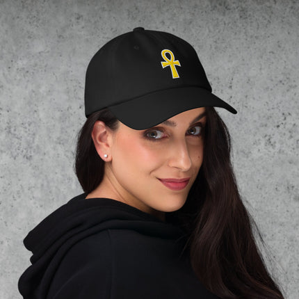 Black dad cap with embroidered gold Ankh symbol of life. Classic black baseball hat design.