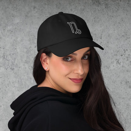 Embroidered dad cap featuring the elegant Capricorn zodiac sign outline for astrology lovers.