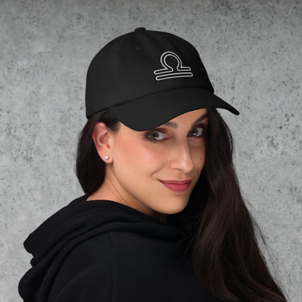 Astrology Libra zodiac embroidered cap featuring scales symbol outline.