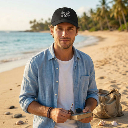 Black baseball cap featuring a cute embroidered crab design for beachwear.