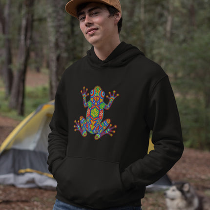 Vibrant Huichol art frog graphic printed on a cozy pullover hoodie with Mexican indigenous flair.
