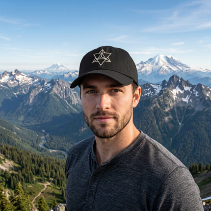 Black baseball cap featuring a white embroidered Merkaba sacred geometry symbol.