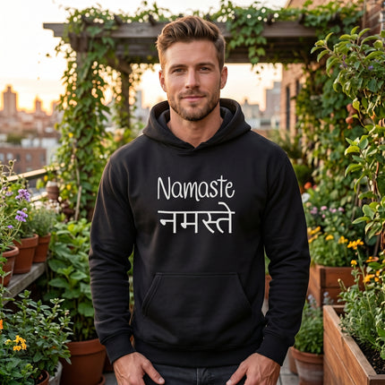 Black Namaste hoodie with English and Hindi spiritual greeting text. Unisex yoga wear.