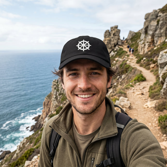 Black baseball cap with embroidered Dharma Wheel symbol.