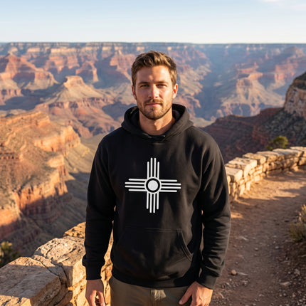 Black hoodie featuring the white Zia Sun Symbol graphic. Unisex pullover fleece for spiritual style.