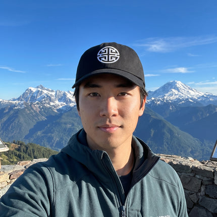 Black baseball cap with embroidered Lu Symbol, representing Chinese prosperity and good fortune.