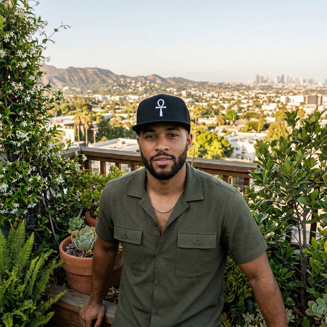 Black snapback hat with embroidered Ankh symbol, representing the Egyptian Key of Life.