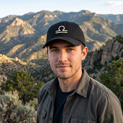 Black dad cap featuring the embroidered Libra zodiac sign symbol.