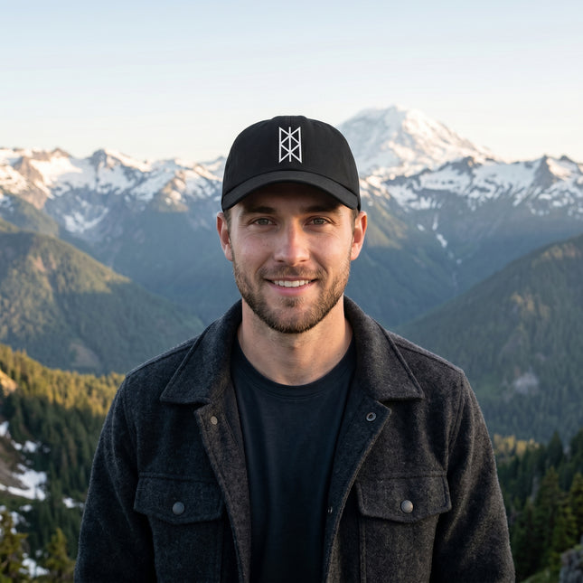Black baseball cap with embroidered Norse Web of Wyrd symbol.