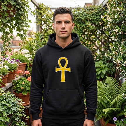 Black hoodie featuring a gold Ankh symbol graphic. Ancient Egyptian mythology apparel.