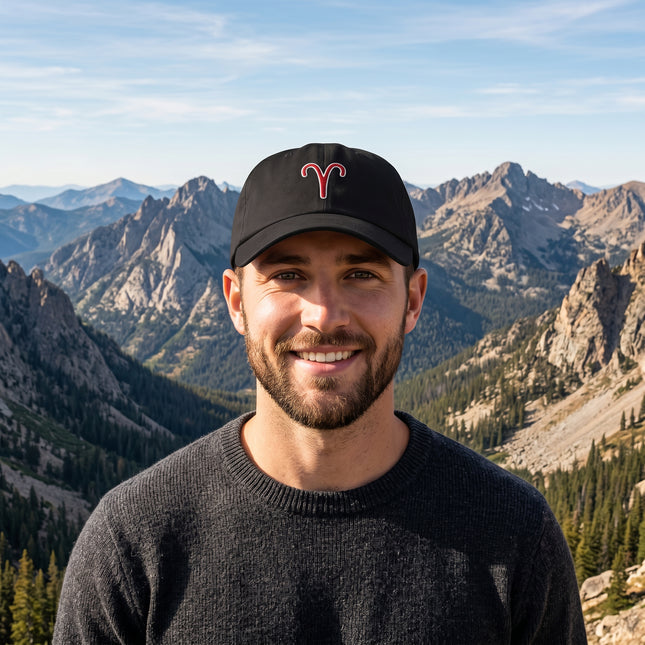 Black baseball cap featuring a red embroidered Aries zodiac symbol.