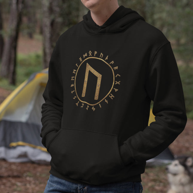 Black hoodie featuring Uruz rune and Elder Futhark Norse mythology symbols in gold.