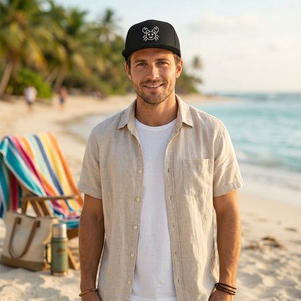 Black snapback cap featuring a cute embroidered smiling crab design for summer beach style.
