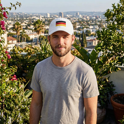 White baseball cap featuring the embroidered German national flag.