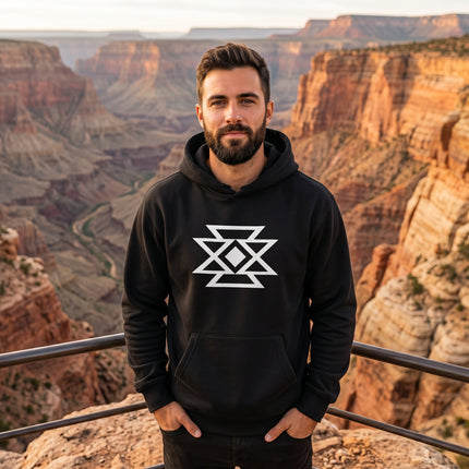 Unisex black pullover hoodie featuring a white geometric butterfly design for cultural wear.