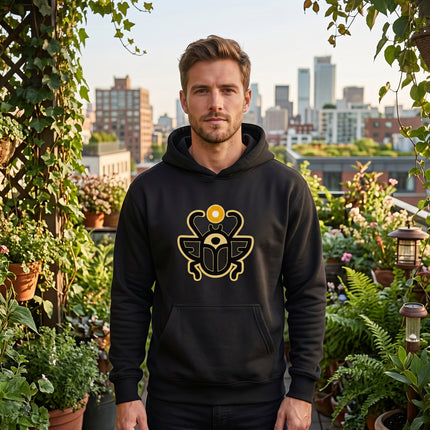 Black hoodie with gold Khepri scarab beetle graphic, representing Egyptian rebirth and mythology.