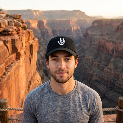 Embroidered Hopi Healing Hand symbol on a black baseball cap.