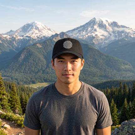Black dad hat embroidered with the Chinese Shou longevity symbol. Minimalist Asian culture streetwear headwear.