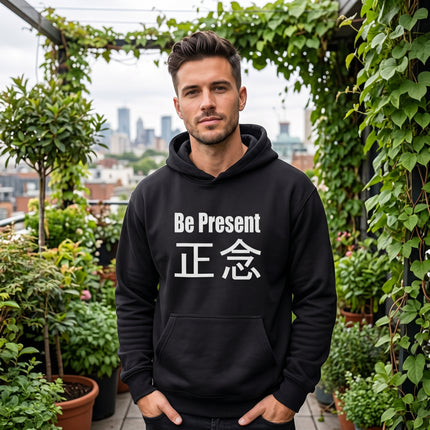 Black pullover hoodie featuring "Be Present" and 正念, ideal for mindfulness and zen meditation apparel.