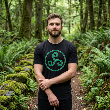 Black t-shirt featuring a green Celtic Triskele knotwork symbol. Triple spiral triskelion graphic tee.