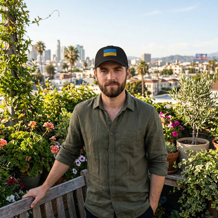 Black embroidered baseball cap featuring the Ukrainian flag design.
