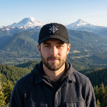 Mystic embroidered dad hat featuring witch's knot and celestial symbols.