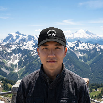 Black dad hat featuring the embroidered Double Happiness Chinese symbol.