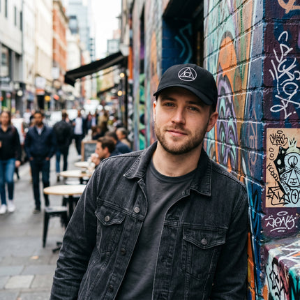 Black baseball cap featuring embroidered Philosopher's Stone and alchemy symbol.