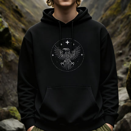 Norse raven knotwork graphic on a black hoodie. Features spread wings and Viking mythology symbolism.