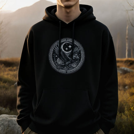 Norse raven hoodie featuring a celestial raven and moon design. Viking mythology art pullover.