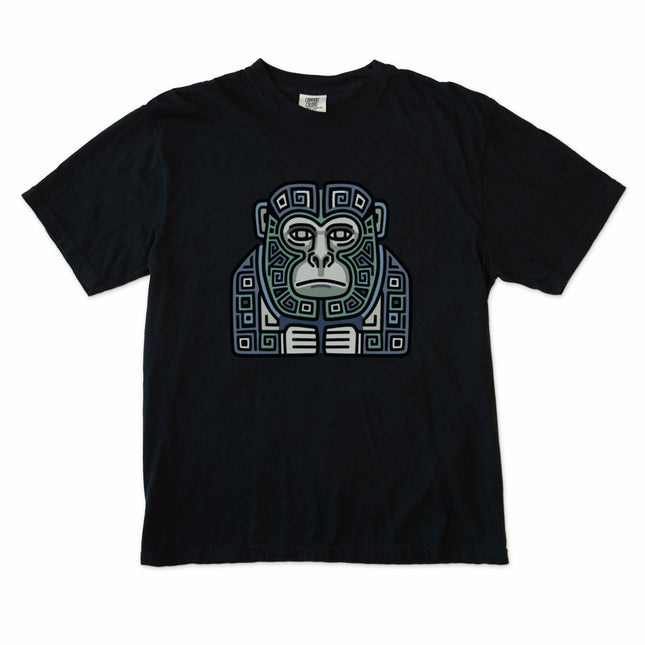 Geometric tribal art t-shirt featuring a blue and green Mayan monkey graphic design.