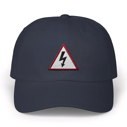 Navy baseball cap featuring an embroidered high voltage lightning bolt warning sign.