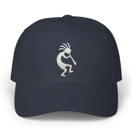 Embroidered Kokopelli flute player design on a dark blue baseball cap.