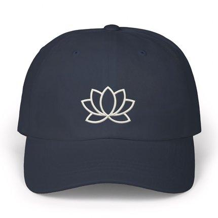 Minimalist lotus flower embroidery on a dark spiritual baseball cap.