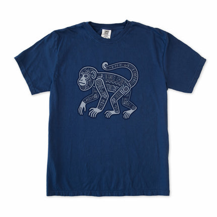 Tribal geometric monkey graphic on a t-shirt featuring ancient Mayan art symbols.