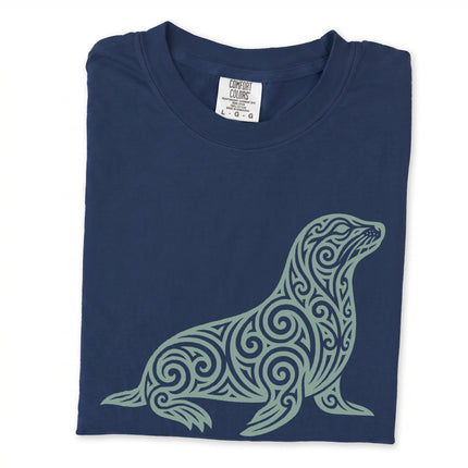 Tribal swirl seal and ornate marine animal graphic print on a comfortable t-shirt.