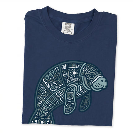 Geometric tribal manatee print on a unisex t-shirt featuring ocean animal art.