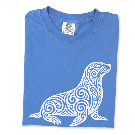 Ornate tribal seal and marine animal graphic printed on a comfortable t-shirt.