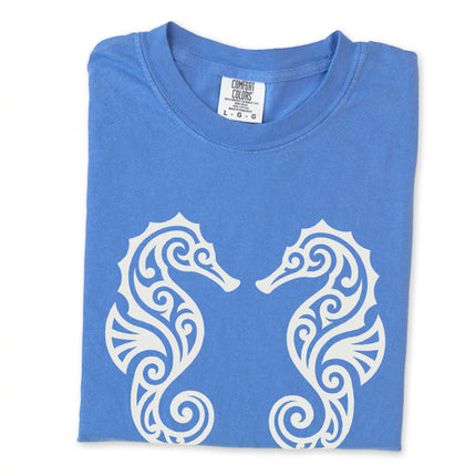 Ornate tribal seahorses and marine life design printed on a unisex t-shirt.
