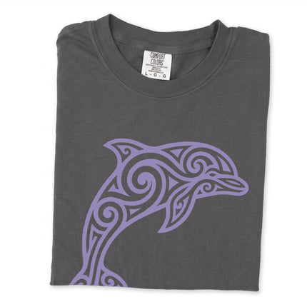 Tribal dolphin swirl art graphic printed on an ocean-themed comfort colors t-shirt.
