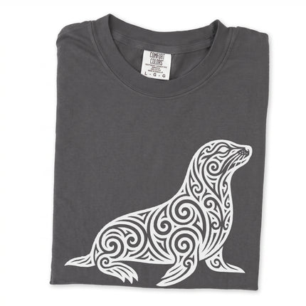Ornate tribal swirl seal graphic tee featuring detailed marine animal artwork.